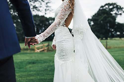 holding hands bride and groom holding hans person
